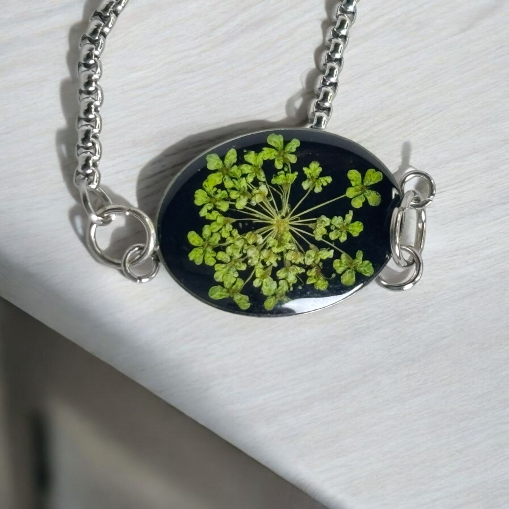 Nature-inspired green petal bracelet with dark contrast