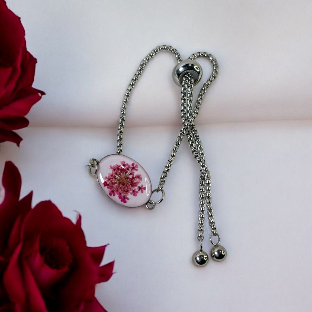 Artistic resin bracelet with vibrant red floral accents
